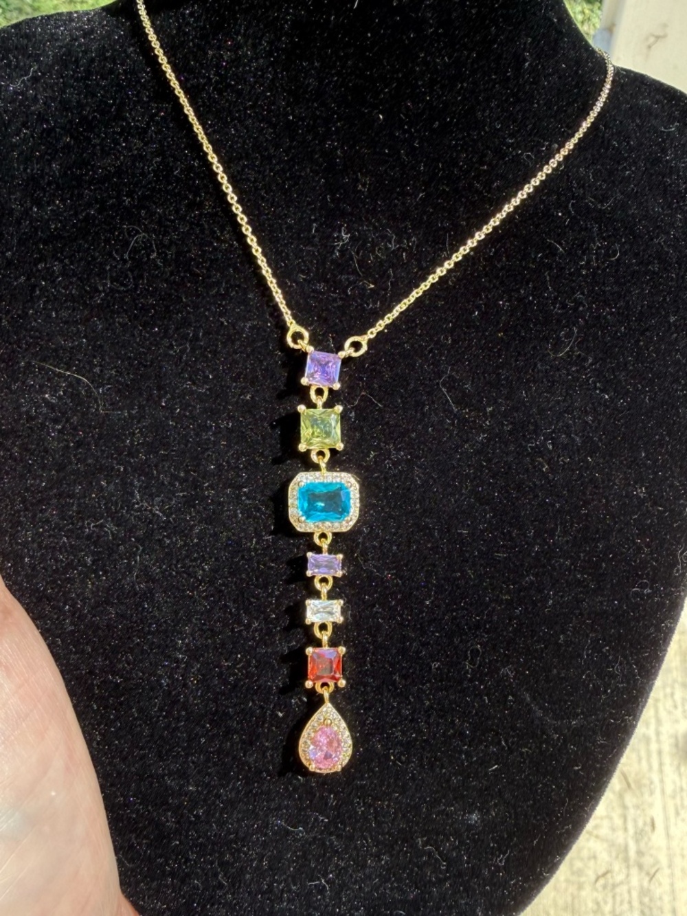 Multicolored gemstone necklace cascading down with sparkly colors - Picture 4 of 7